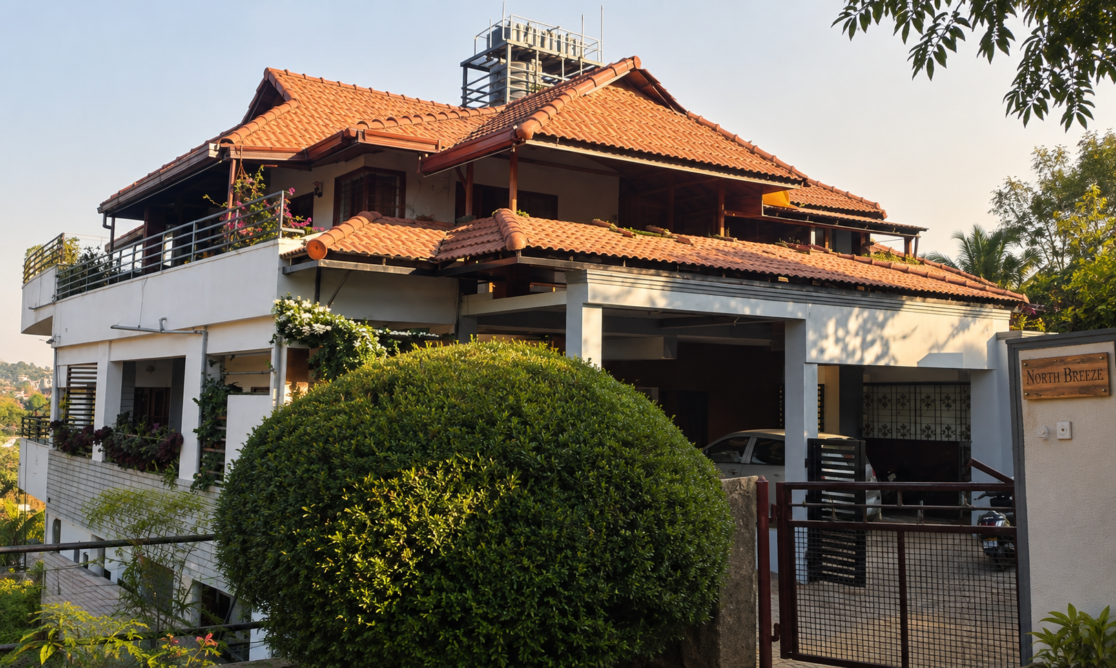 The North Breeze homestay in golden evening light, with its terracotta tiled roof